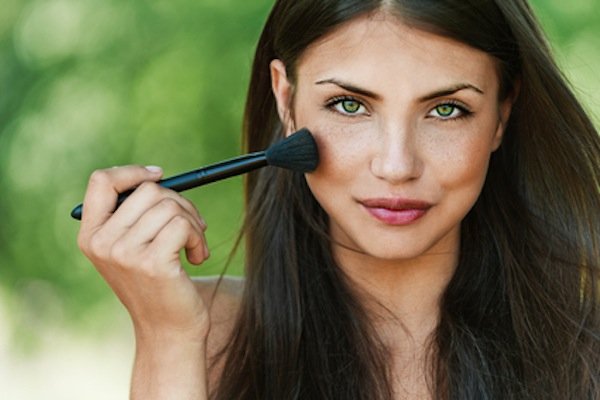 Girl with brush for makeup